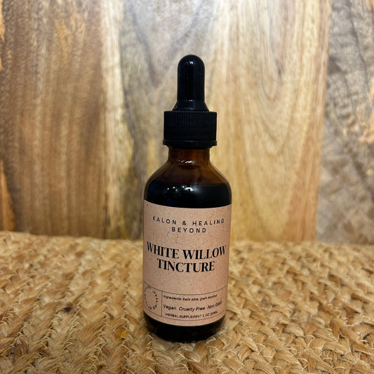 Bottle of White Willow Tincture on a wooden surface